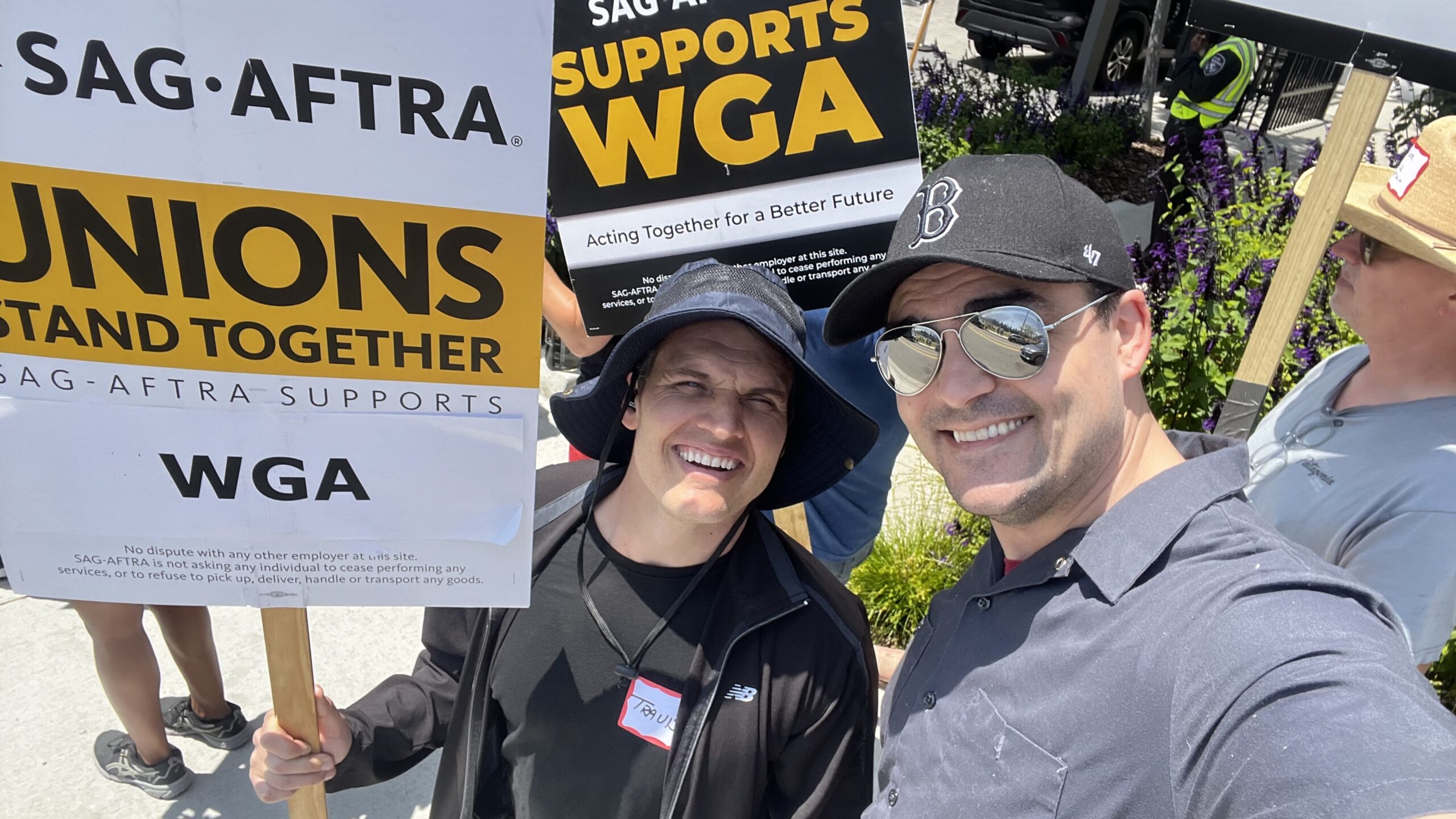 Walking the picket line for the WGA outside of Netflix in Hollywood, CA with my buddy Travis J. Dixon